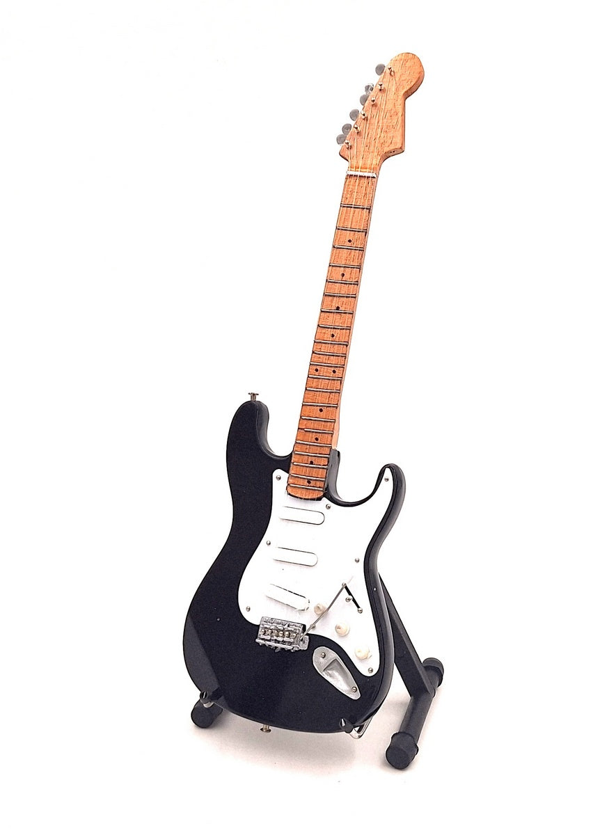Mini guitarra inspirada en Kurt Cobain con posibilidad de personalización mediante grabado, hecha a mano en madera de caoba, negra/blanca, altura 27,5 cm