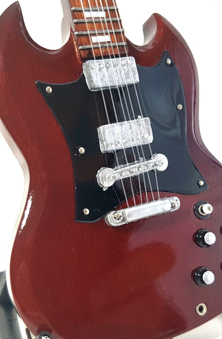 Mini guitarra AC/DC Angus Young MGT-0567 con posibilidad de grabado personalizado, ideal para regalo, hecha a mano en madera de caoba, color marrón, altura 27,5 cm  