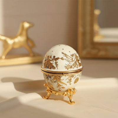 Exclusiva caja joyero huevo Fabergé metálico con cristales en color blanco y dorado con posibilidad de personalización con grabado