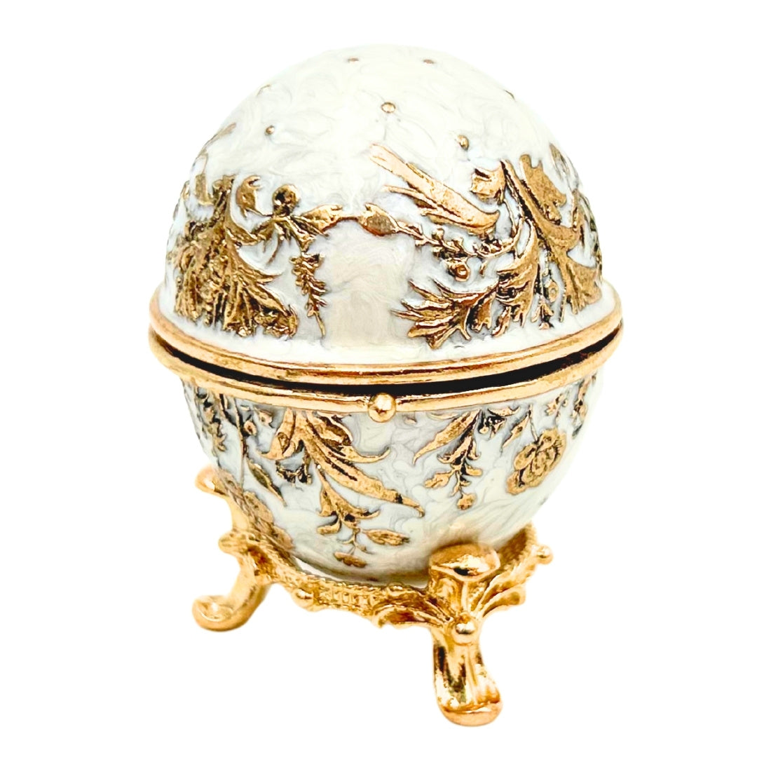Exclusiva caja joyero huevo Fabergé metálico con cristales en color blanco y dorado con posibilidad de personalización con grabado