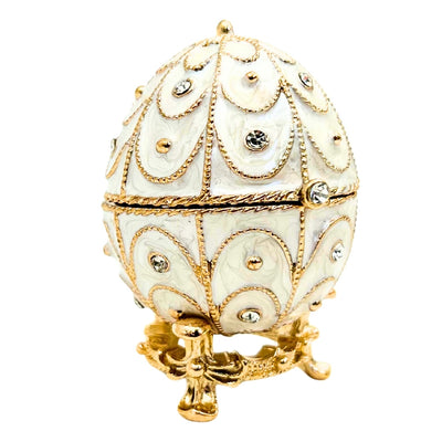 Exclusiva caja joyero huevo Fabergé metálico con cristales en color blanco y dorado con posibilidad de personalización con grabado
