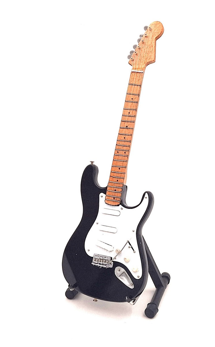 Mini guitarra inspirada en Kurt Cobain con posibilidad de personalización mediante grabado, hecha a mano en madera de caoba, negra/blanca, altura 27,5 cm